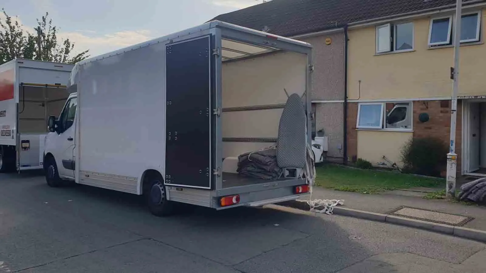 Pro Load Solutions - Man and a Van - van parked outside of house